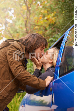 Transport, road trip and couple kiss in car for greeting, goodbye and love for journey, leaving and commute. Travel, driving and man and woman in vehicle window for bonding, relationship and embrace Transport, road trip and couple kiss in car for greeting, goodbye and love for journey, leaving and commute. Travel, driving and man and woman in vehicle window for bonding, relationship and embrace 140682810