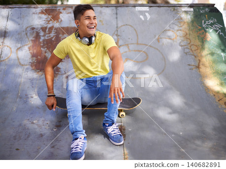 Skateboard, happy and man in skate park for training, exercise and skating in city. Skater, fashion and teenager laughing in trendy, casual outfit and street style for sports, fun hobby and fitness Skateboard, happy and man in skate park for training, exercise and skating in city. Skater, fashion and teenager laughing in trendy, casual outfit and street style for sports, fun hobby and fitness 140682891