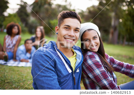 Couple, smile and portrait with love in park for bonding and fun on campus outdoor. Students, grass and happy together in a university garden on a break on a picnic with college people with care Couple, smile and portrait with love in park for bonding and fun on campus outdoor. Students, grass and happy together in a university garden on a break on a picnic with college people with care 140682913
