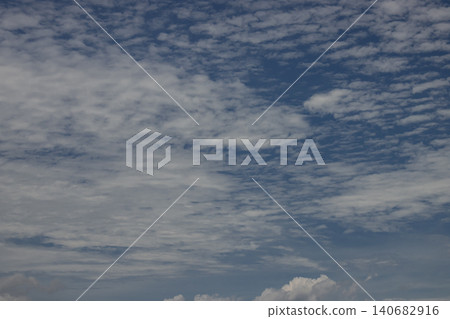 Sky cloud blue weather texture background atmosphere nature, wide view of altocumulus pattern across daytime horizon, calm airy mood, natural abstract backdrop for design and copy space Sky cloud blue weather texture background atmosphere nature, wide view of altocumulus pattern across daytime horizon, calm airy mood, natural abstract backdrop for design and copy space 140682916