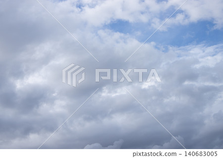 Cloud sky overcast cumulus weather blue gray cloudscape, soft layered clouds drift across open atmosphere, calm moody daylight background with copy space for design Cloud sky overcast cumulus weather blue gray cloudscape, soft layered clouds drift across open atmosphere, calm moody daylight background with copy space for design 140683005