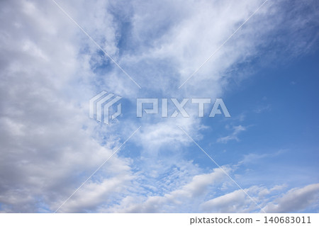 Blue sky cloud white cloud cloudscape atmosphere weather sunlight nature with soft cirrus and cumulus pattern creating calm serene background for summer outdoor design 140683011