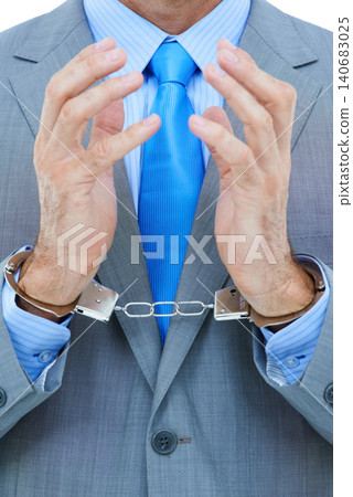 Businessman, hands and cuffs with strain for theft, crime or corruption on a white studio background. Closeup of man or employee tied up with chain for arrest, criminal or illegal bribery of the law Businessman, hands and cuffs with strain for theft, crime or corruption on a white studio background. Closeup of man or employee tied up with chain for arrest, criminal or illegal bribery of the law 140683025