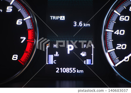 Digital dashboard speedometer tachometer odometer trip meter vehicle instrument panel car display fuel gauge engine temperature gauge mileage 3.6 km 210855 km parking gear illuminated panel black 140683037