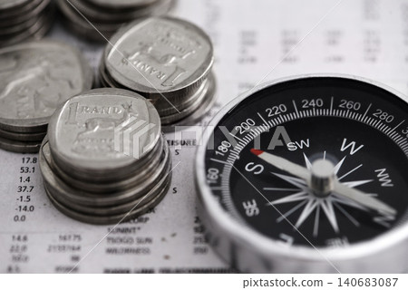 Coins, compass and business section of newspaper for exchange rate and direction on stock market for investor. Information, money and illustration of forex trading and financial indicators on paper Coins, compass and business section of newspaper for exchange rate and direction on stock market for investor. Information, money and illustration of forex trading and financial indicators on paper 140683087