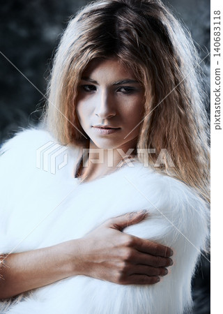 Woman, winter fashion and confident outdoors, attitude and pride for fur coat or warm clothes. Female person, serious face and closeup of fluffy jacket in nature, forest and trendy or casual outfit Woman, winter fashion and confident outdoors, attitude and pride for fur coat or warm clothes. Female person, serious face and closeup of fluffy jacket in nature, forest and trendy or casual outfit 140683118