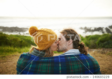 Happy couple, kiss and bonding together in nature, blanket and romantic getaway with camping by ocean. Man, woman or love on vacation on weekend break, cape town or travel adventure by sea in sunset Happy couple, kiss and bonding together in nature, blanket and romantic getaway with camping by ocean. Man, woman or love on vacation on weekend break, cape town or travel adventure by sea in sunset 140683229