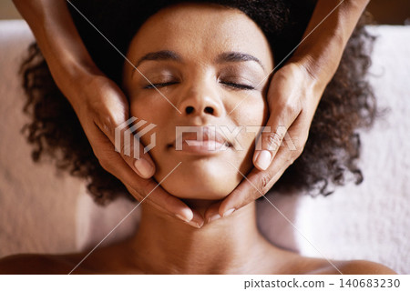 Woman, spa and massage on face with hands and care for facial, wellness and beauty treatment on bed. Above, towel and calm african female person with skincare and relax at a hotel with skin glow Woman, spa and massage on face with hands and care for facial, wellness and beauty treatment on bed. Above, towel and calm african female person with skincare and relax at a hotel with skin glow 140683230