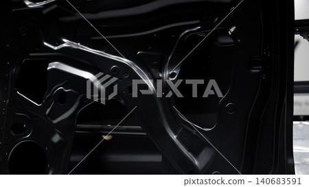 Car door metal sheet. Close up automotive door inner panels and stamped steel body parts. Modern vehicle manufacturing facility. Precision metal forming. Metal Car doors automotive assembly technology Car door metal sheet. Close up automotive door inner panels and stamped steel body parts. Modern vehicle manufacturing facility. Precision metal forming. Metal Car doors automotive assembly technology 140683591