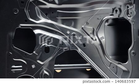 Car door metal sheet. Close up automotive door inner panels and stamped steel body parts. Modern vehicle manufacturing facility. Precision metal forming. Metal Car doors automotive assembly technology Car door metal sheet. Close up automotive door inner panels and stamped steel body parts. Modern vehicle manufacturing facility. Precision metal forming. Metal Car doors automotive assembly technology 140683597