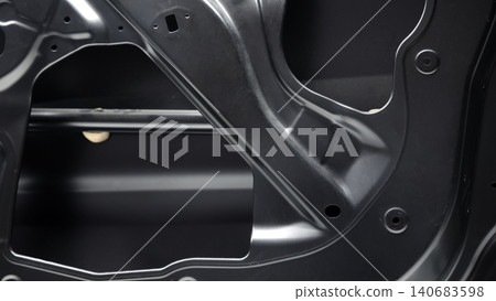 Car door metal sheet. Close up automotive door inner panels and stamped steel body parts. Modern vehicle manufacturing facility. Precision metal forming. Metal Car doors automotive assembly technology Car door metal sheet. Close up automotive door inner panels and stamped steel body parts. Modern vehicle manufacturing facility. Precision metal forming. Metal Car doors automotive assembly technology 140683598