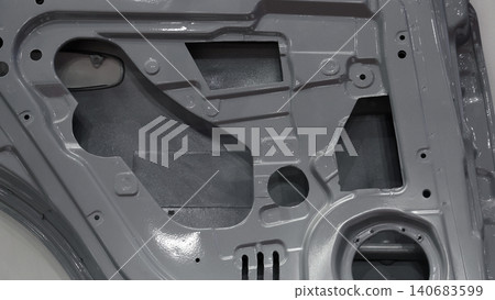 Car door metal sheet. Close up automotive door inner panels and stamped steel body parts. Modern vehicle manufacturing facility. Precision metal forming. Metal Car doors automotive assembly technology Car door metal sheet. Close up automotive door inner panels and stamped steel body parts. Modern vehicle manufacturing facility. Precision metal forming. Metal Car doors automotive assembly technology 140683599