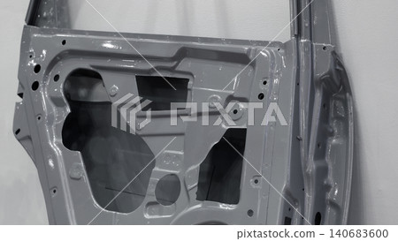 Car door metal sheet. Close up automotive door inner panels and stamped steel body parts. Modern vehicle manufacturing facility. Precision metal forming. Metal Car doors automotive assembly technology Car door metal sheet. Close up automotive door inner panels and stamped steel body parts. Modern vehicle manufacturing facility. Precision metal forming. Metal Car doors automotive assembly technology 140683600