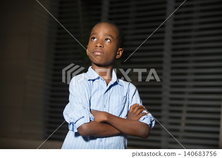 portrait of a young boy with crossed arms. portrait of a young boy with crossed arms. 140683756