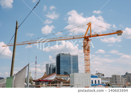 Construction site with tower crane and modern city skyline in Yekaterinburg Russia Construction site with tower crane and modern city skyline in Yekaterinburg Russia 140683894