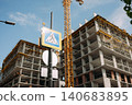 High rise building under construction with tower crane 140683895