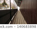 Temporary pedestrian walkway along construction site 140683898