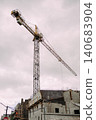 Orthodox church construction with tower crane 140683904