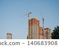 High rise building under construction with tower crane 140683908