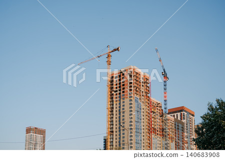 High rise building under construction with tower crane 140683908
