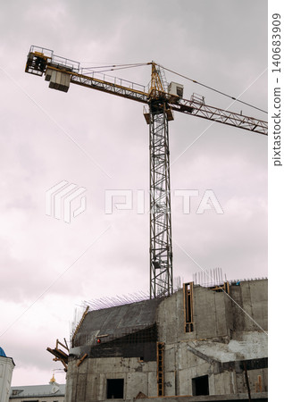 Orthodox church construction with tower crane 140683909