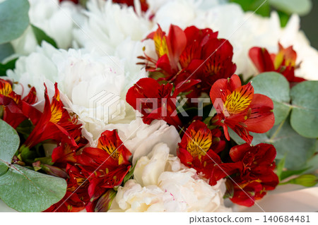 Bouquet with red ribbon in a box Bouquet with red ribbon in a box 140684481