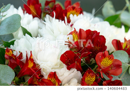 Bouquet with red ribbon in a box Bouquet with red ribbon in a box 140684483