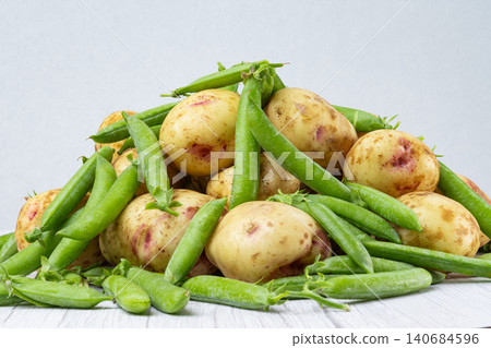potatoes with peas and zucchini potatoes with peas and zucchini 140684596