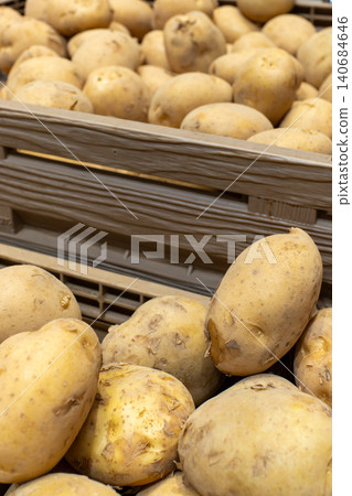 Freshly picked raw potatoes lined up in the vegetable section. Freshly picked raw potatoes lined up in the vegetable section. 140684646
