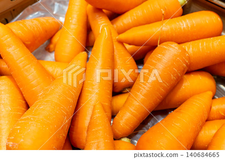 A close-up of a bright orange carrot. A close-up of a bright orange carrot. 140684665