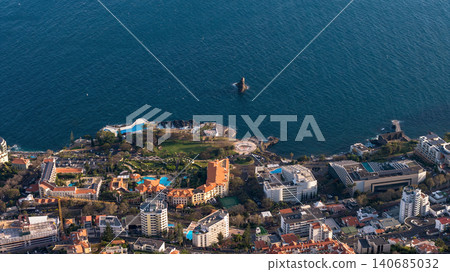 Aerial view of Funchal coastal hotel zone with Ilheu do Gorgulho 140685032