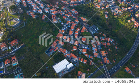 Aerial hillside neighborhood on Madeira Island with terracotta roofs Aerial hillside neighborhood on Madeira Island with terracotta roofs 140685042