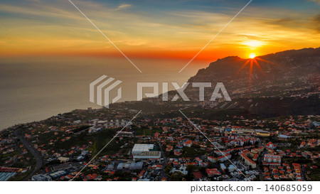 Aerial sunset over Madeira near Camara de Lobos and Funchal ridge Aerial sunset over Madeira near Camara de Lobos and Funchal ridge 140685059