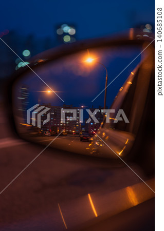 Night streetlights in side mirror reflect Minsk apartment blocks Night streetlights in side mirror reflect Minsk apartment blocks 140685108