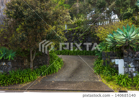 Uphill driveway with basalt walls and agave on Madeira, morning 140685140