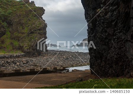 Basalt cove gateway on Madeira's north coast with sea stacks and surf 140685150