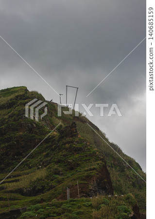 Cliffside viewpoint and metal frame on coastal hill, Madeira, Portugal Cliffside viewpoint and metal frame on coastal hill, Madeira, Portugal 140685159