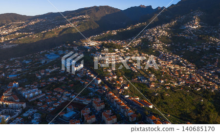 Aerial terraced neighborhoods on Madeira hills near Funchal at dusk Aerial terraced neighborhoods on Madeira hills near Funchal at dusk 140685170