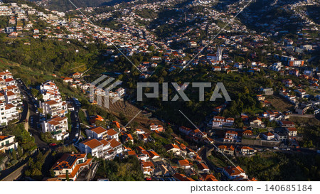 Aerial terraced hillside town on Madeira Island with bell tower 140685184