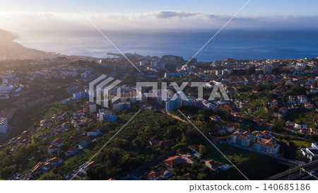 Aerial view of Funchal, Madeira, hillside city, harbor, and sea Aerial view of Funchal, Madeira, hillside city, harbor, and sea 140685186