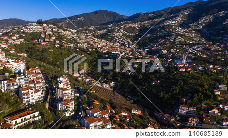 Aerial hillside town near Funchal, Madeira Island, twin spired church 140685189