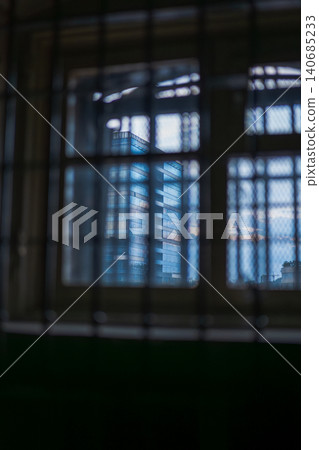 Lukiskes Prison barred window frames modern glass high rise in Vilnius Lukiskes Prison barred window frames modern glass high rise in Vilnius 140685233