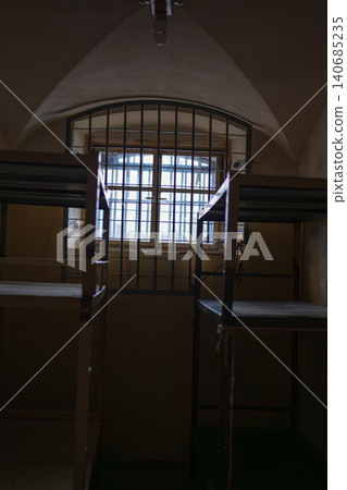 Historic Lukiskes Prison cell with barred arched window, Vilnius Historic Lukiskes Prison cell with barred arched window, Vilnius 140685235