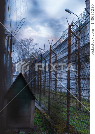 Prison yard corridor at Lukiskes Prison in Vilnius at dusk Prison yard corridor at Lukiskes Prison in Vilnius at dusk 140685250