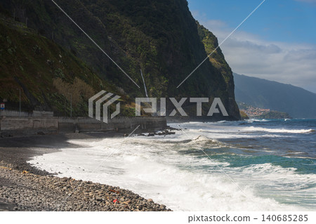 Madeira north coast cliffs, roadside waterfall, waves, village bay Madeira north coast cliffs, roadside waterfall, waves, village bay 140685285