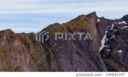 Lofoten Islands Dramatic Mountain Peaks with Snow and Moss Lofoten Islands Dramatic Mountain Peaks with Snow and Moss 140685347