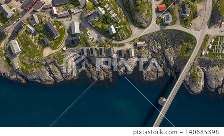 Aerial View of Lofoten Islands Coastal Settlement with Rocky Cliffs and Modern Houses Aerial View of Lofoten Islands Coastal Settlement with Rocky Cliffs and Modern Houses 140685398