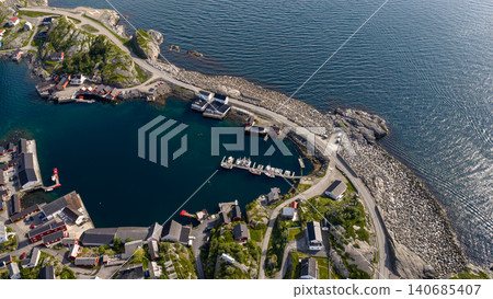 Aerial View of Lofoten Fishing Village Harbor with Boats and Rocky Coastline Aerial View of Lofoten Fishing Village Harbor with Boats and Rocky Coastline 140685407