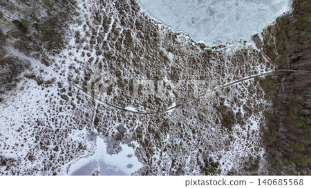 Aerial View of Snow Covered Wetland with Wooden Boardwalk 140685568