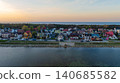 Coastal Town at Sunset with Colorful Houses and Waterfront Road 140685582